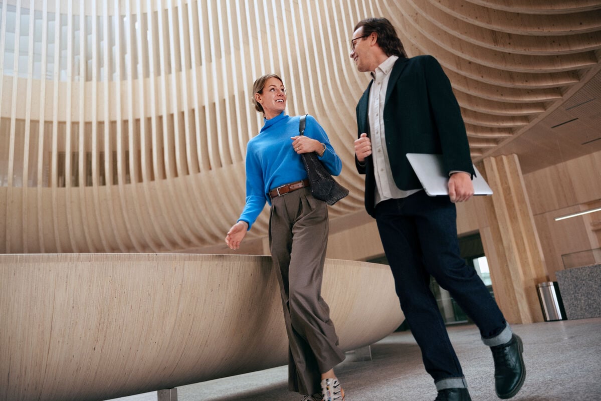 Two people walking and talking